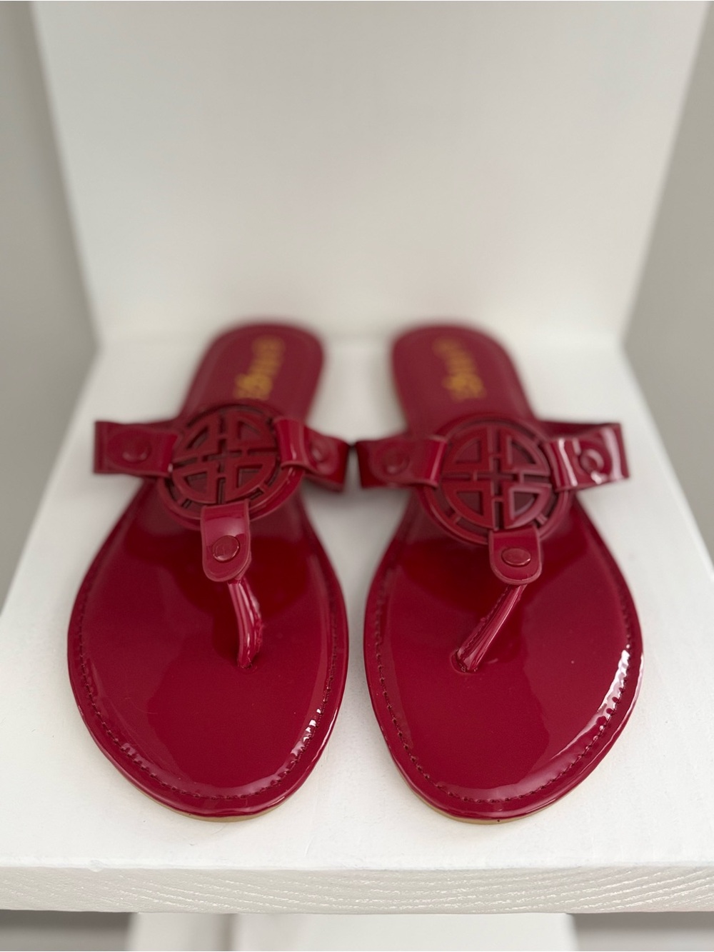 Rouge! Glossy Red Patent Thong Sandals with Decorative Medallion